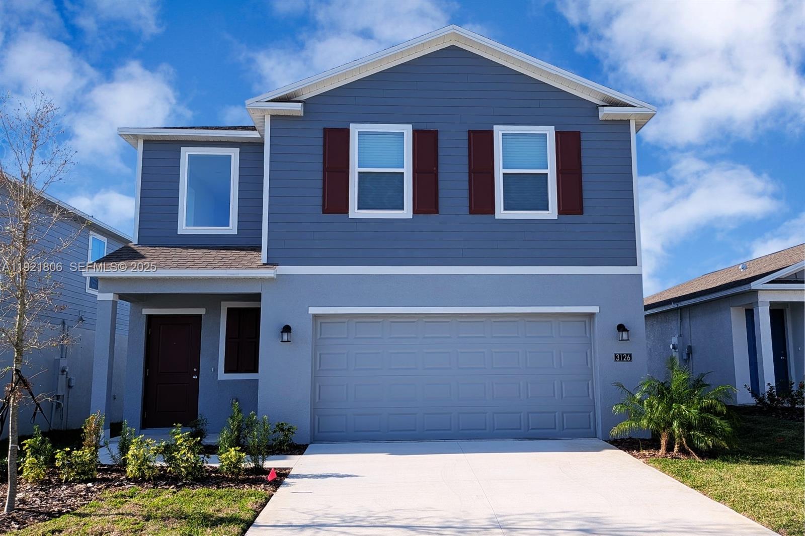 a view of a house with a yard