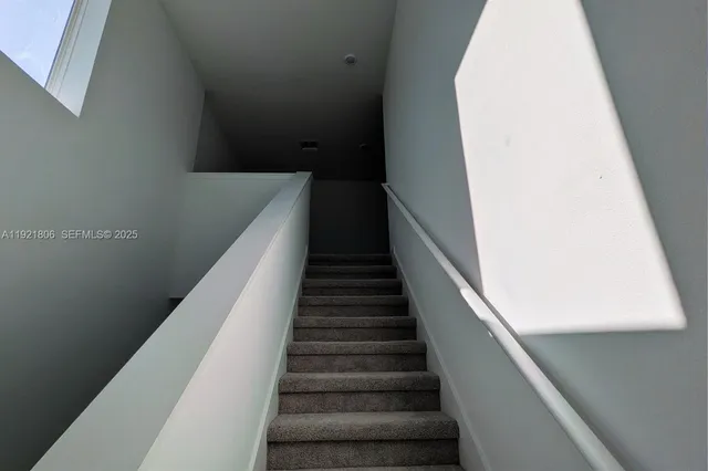 a view of balcony with wooden floor and stairs