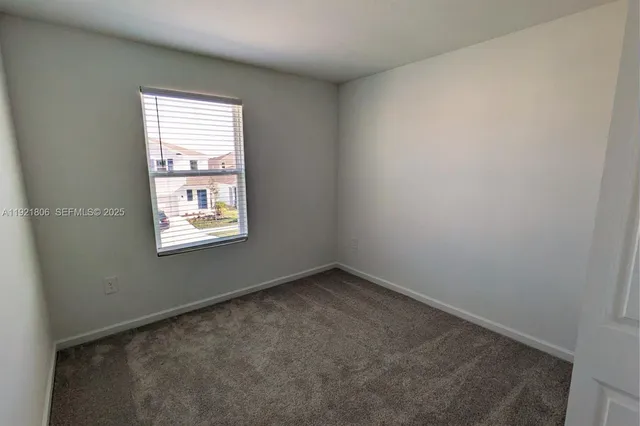a bathroom with a granite countertop toilet a sink and shower