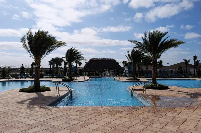 a view of a room with lots of wooden furniture