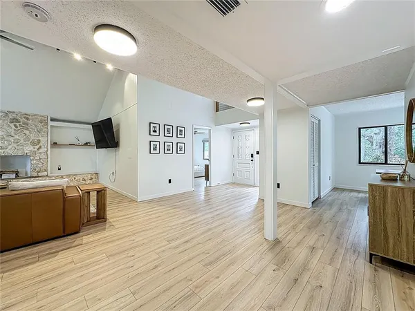 a bathroom with a double vanity sink toilet and shower