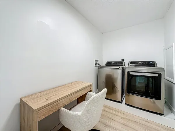 a room with lots of wooden furniture and wooden floor