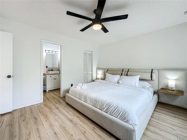 a large kitchen with stainless steel appliances granite countertop a stove and a refrigerator