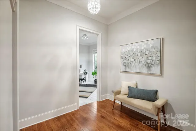 a living room with furniture and a painting