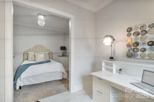 a bedroom with a bed and a table