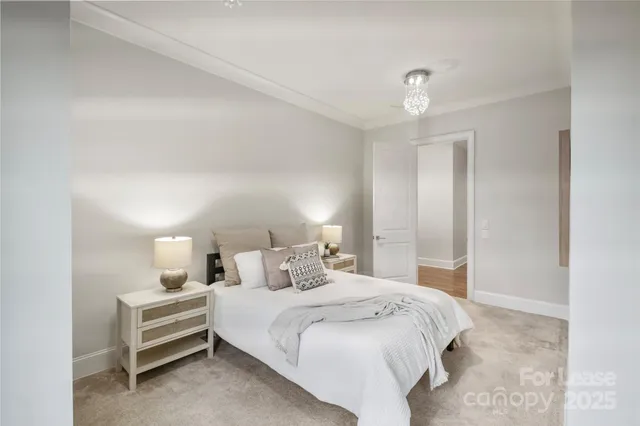 a bedroom with a bed and a night stand