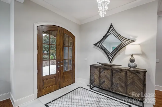 a view of an entryway with wooden floor