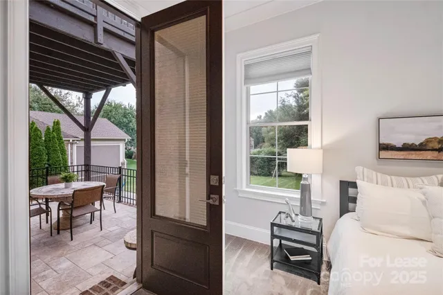 a bedroom with furniture and a window