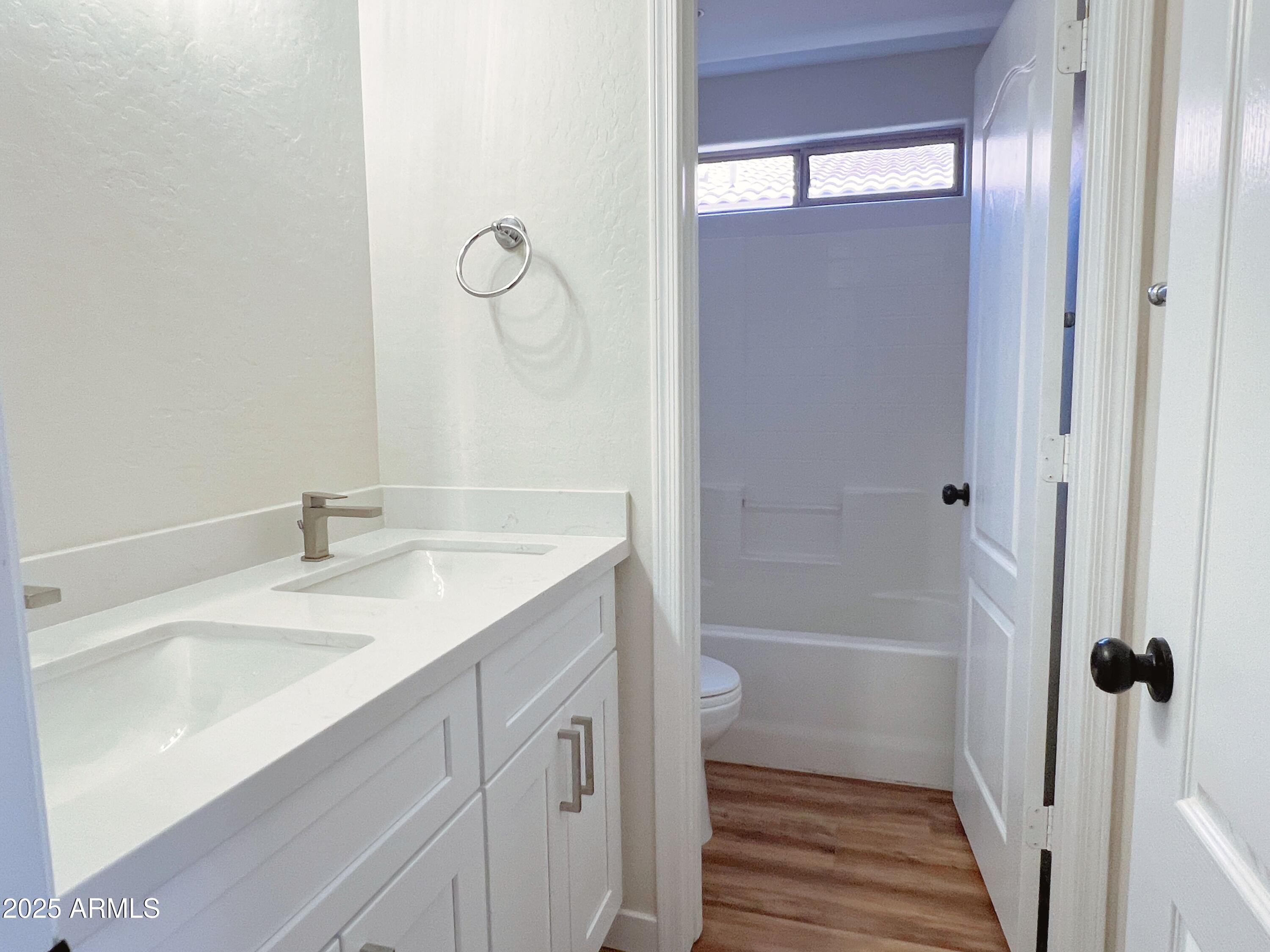 5415 East McKellips Road, Unit 90 Mesa, AZ 85215 - Photo 13 of 16 a bathroom with a sink a toilet and shower