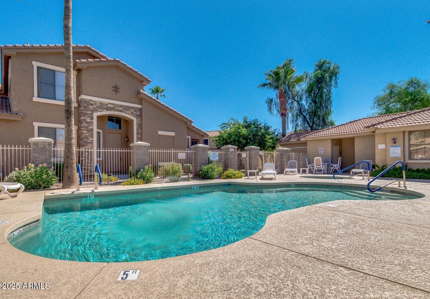 5415 East McKellips Road, Unit 90 Mesa, AZ 85215 - Photo 15 of 16 a front view of house with yard and green space