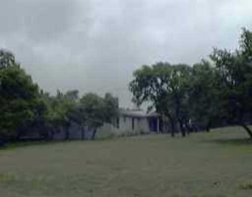 8502 Crest View Road Austin, TX 78737 - Photo 1 of 1 a view of a house with a yard