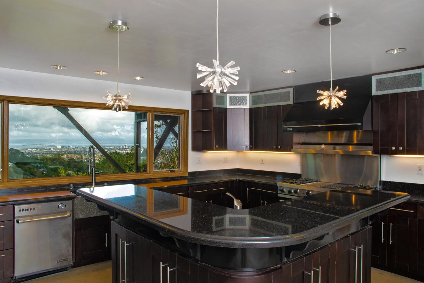 15 Anson Road Hillsborough, CA 94010 - Photo 11 of 18 a kitchen with kitchen island a sink and a large window