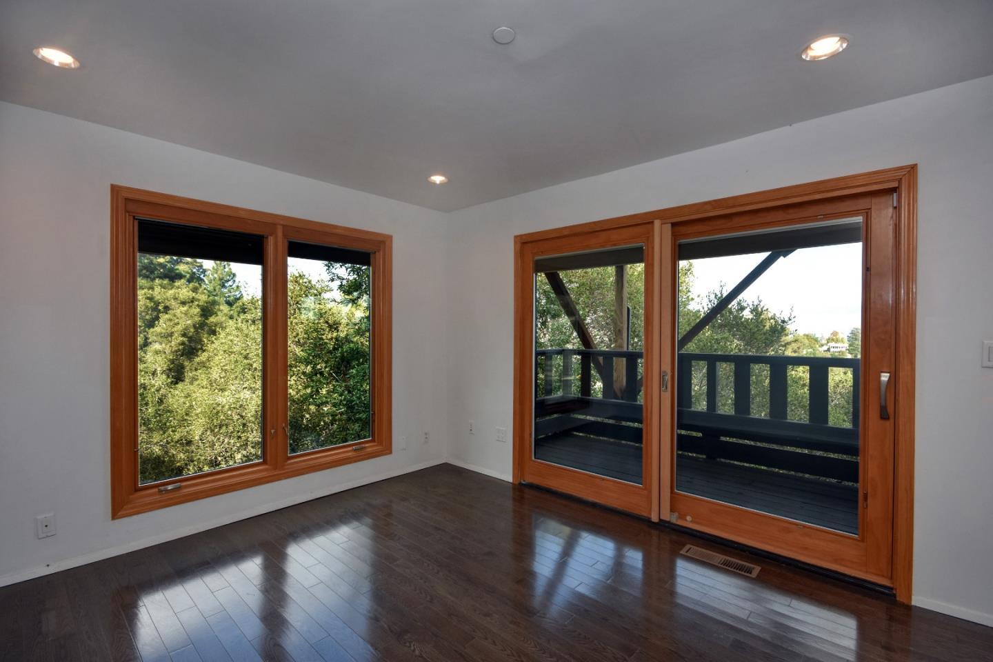 15 Anson Road Hillsborough, CA 94010 - Photo 13 of 18 a view of empty room with wooden floor and floor to ceiling window