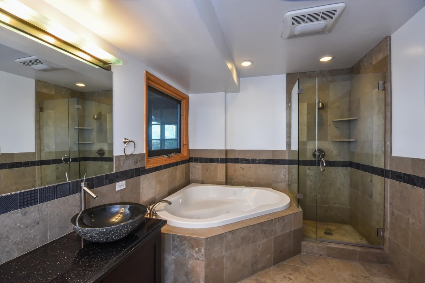15 Anson Road Hillsborough, CA 94010 - Photo 14 of 18 a bathroom with a sink and a large mirror