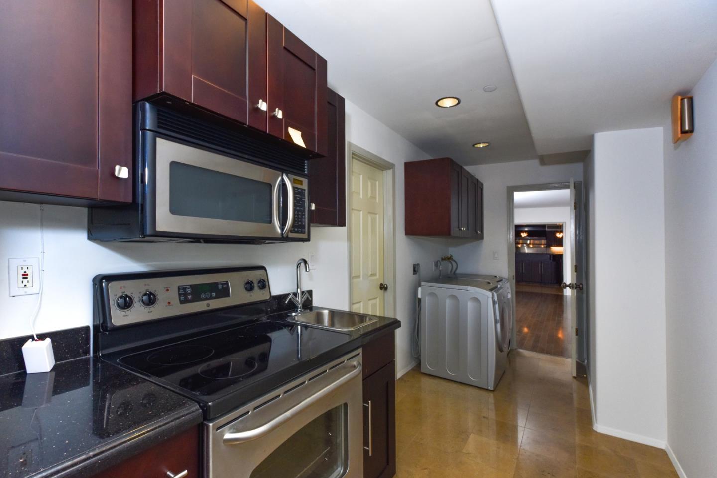 15 Anson Road Hillsborough, CA 94010 - Photo 2 of 18 a kitchen with a stove and a microwave
