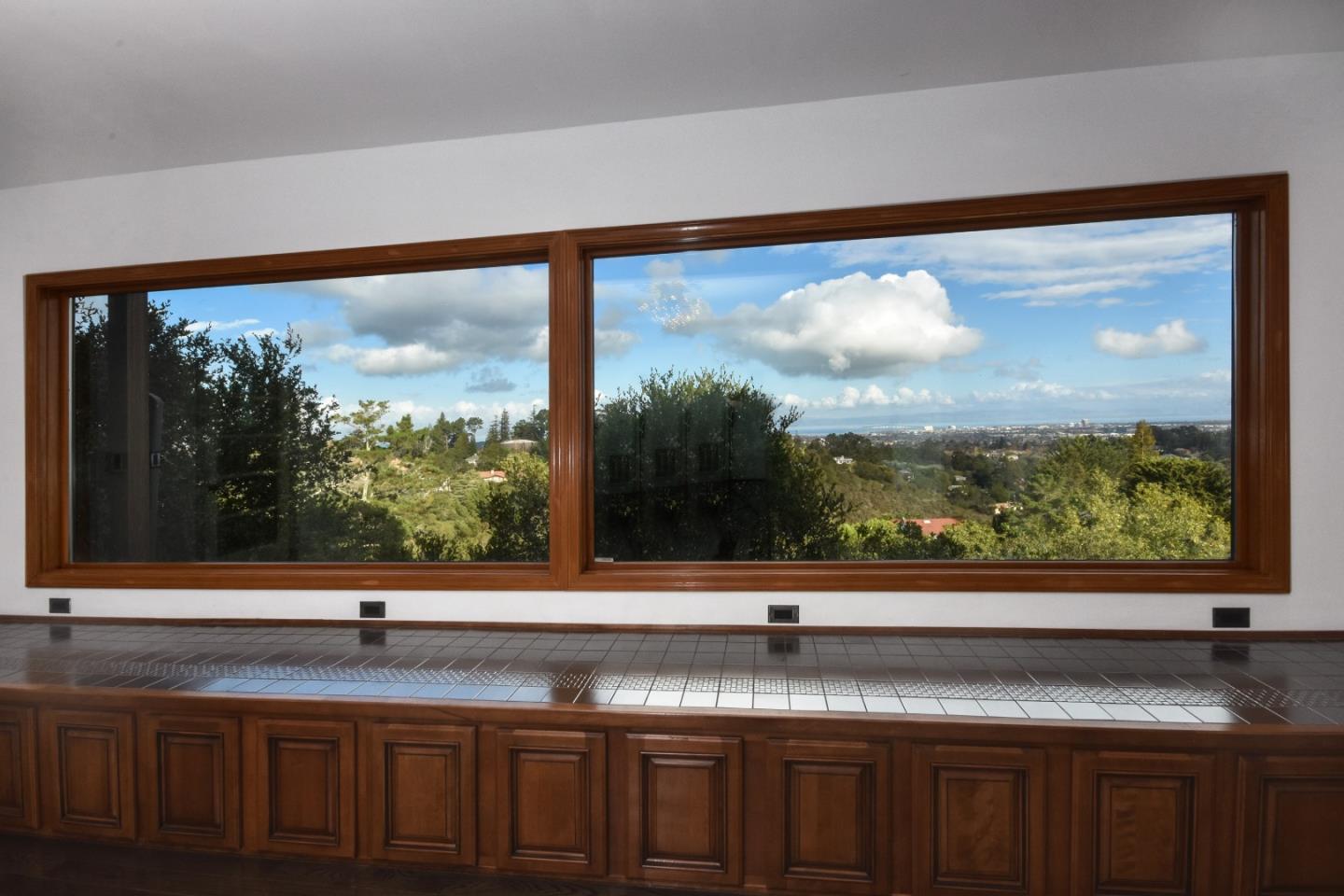15 Anson Road Hillsborough, CA 94010 - Photo 5 of 18 a view of a kitchen with granite countertop a sink and a large window