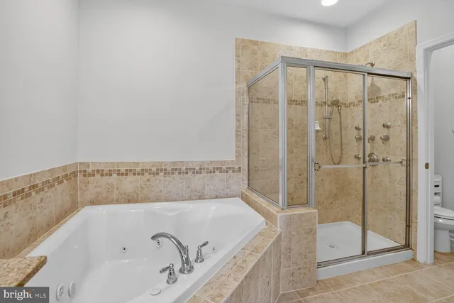 a bathroom with a bathtub and shower