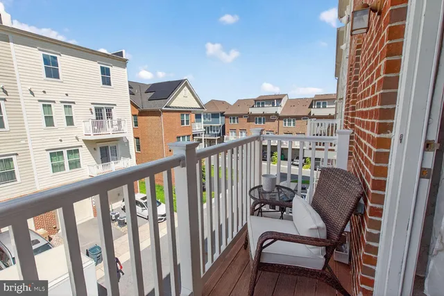 a view of a balcony with chairs