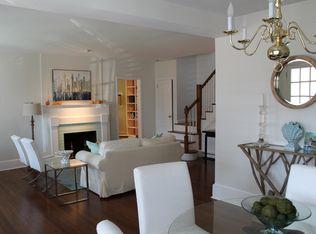 9 Juniper Road Rowayton, CT 06853 - Photo 3 of 25 a living room with furniture a fireplace and a chandelier