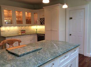 9 Juniper Road Rowayton, CT 06853 - Photo 5 of 25 a kitchen with stainless steel appliances granite countertop a sink a stove and a granite counter tops with white cabinets