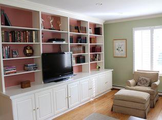 9 Juniper Road Rowayton, CT 06853 - Photo 9 of 25 a room with furniture a rug and a bookshelf