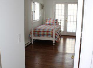 9 Juniper Road Rowayton, CT 06853 - Photo 10 of 25 a bedroom with a bed and a window