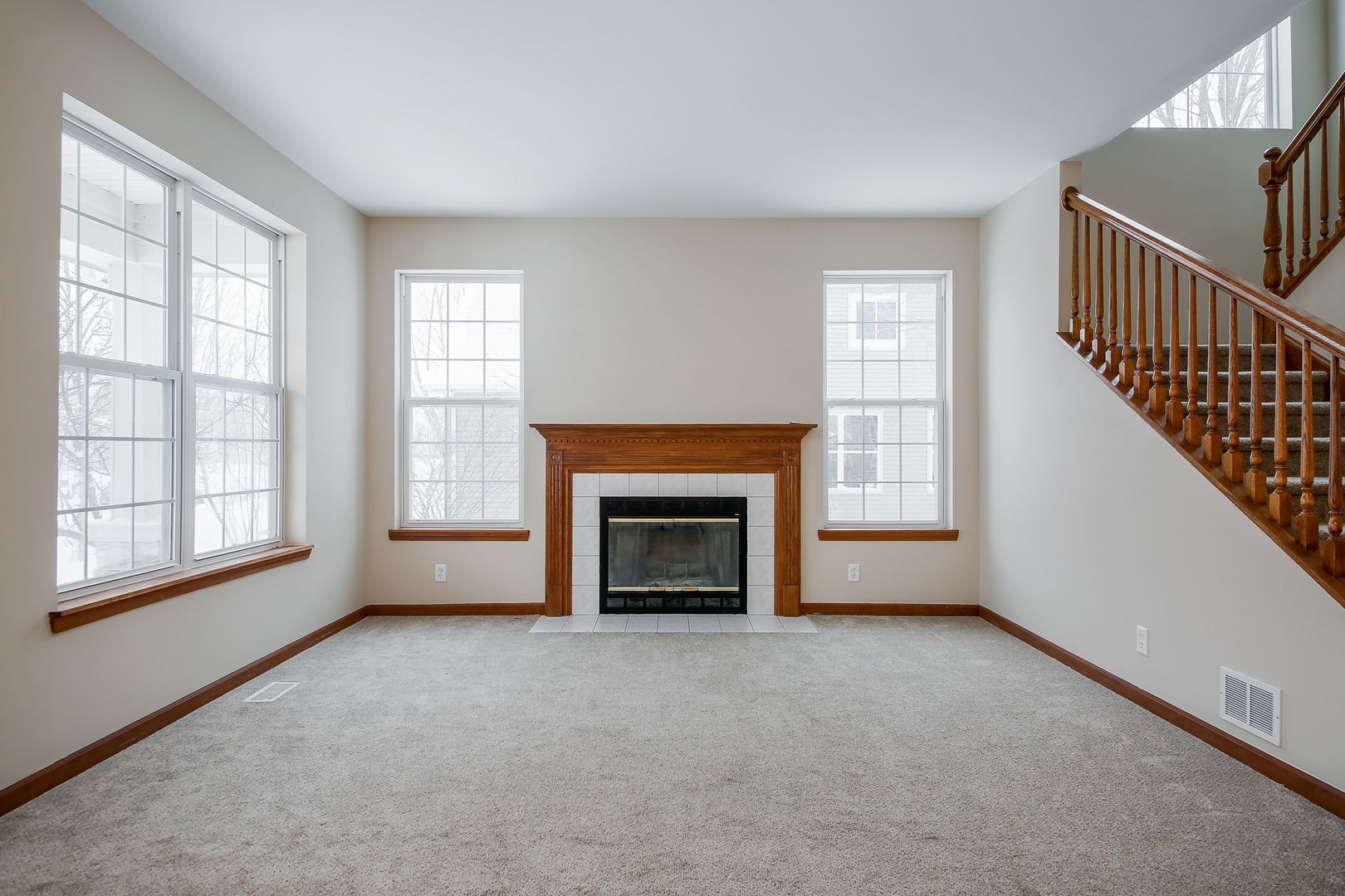 745 Boyce Road Sugar Grove, IL 60554 - Photo 4 of 38 a view of an empty room with a window and fireplace