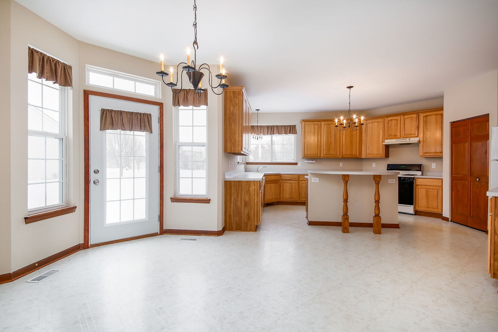 745 Boyce Road Sugar Grove, IL 60554 - Photo 8 of 38 a view of kitchen with refrigerator and wooden floor