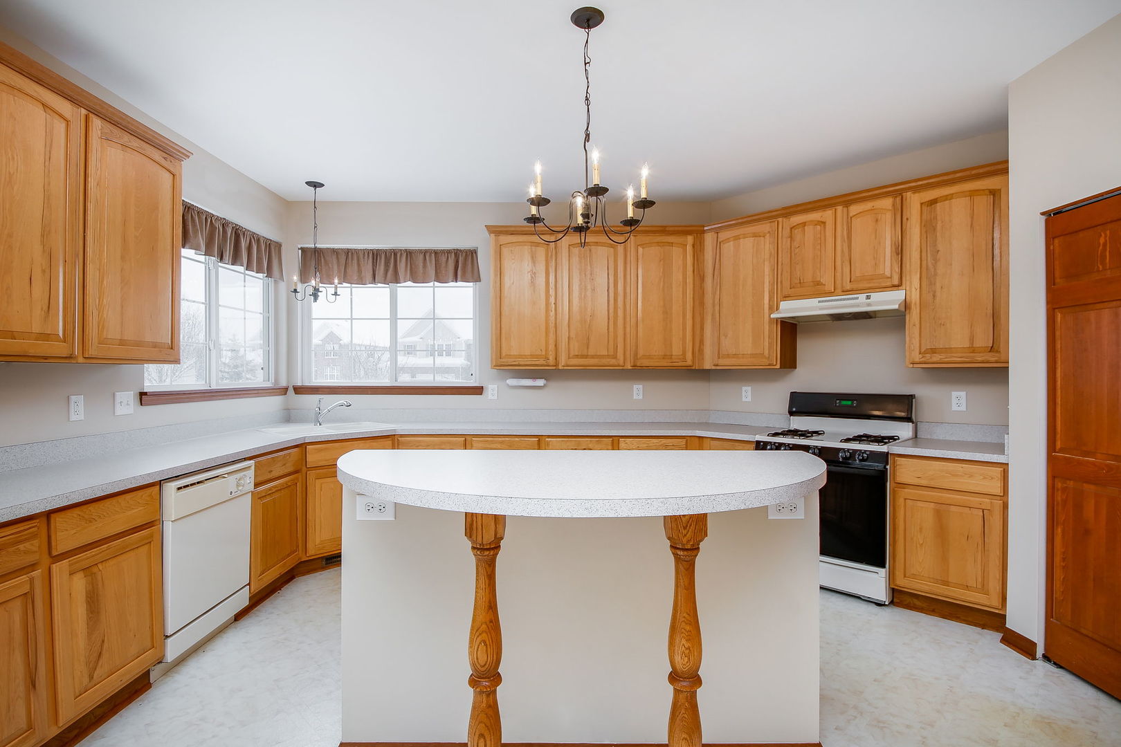 745 Boyce Road Sugar Grove, IL 60554 - Photo 9 of 38 a kitchen with stainless steel appliances granite countertop a stove a sink and a refrigerator