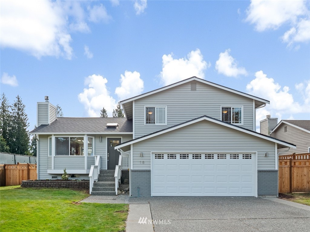 18 199th Place Southeast Bothell, WA 98012 - Photo 1 of 23 a view of a house with a yard