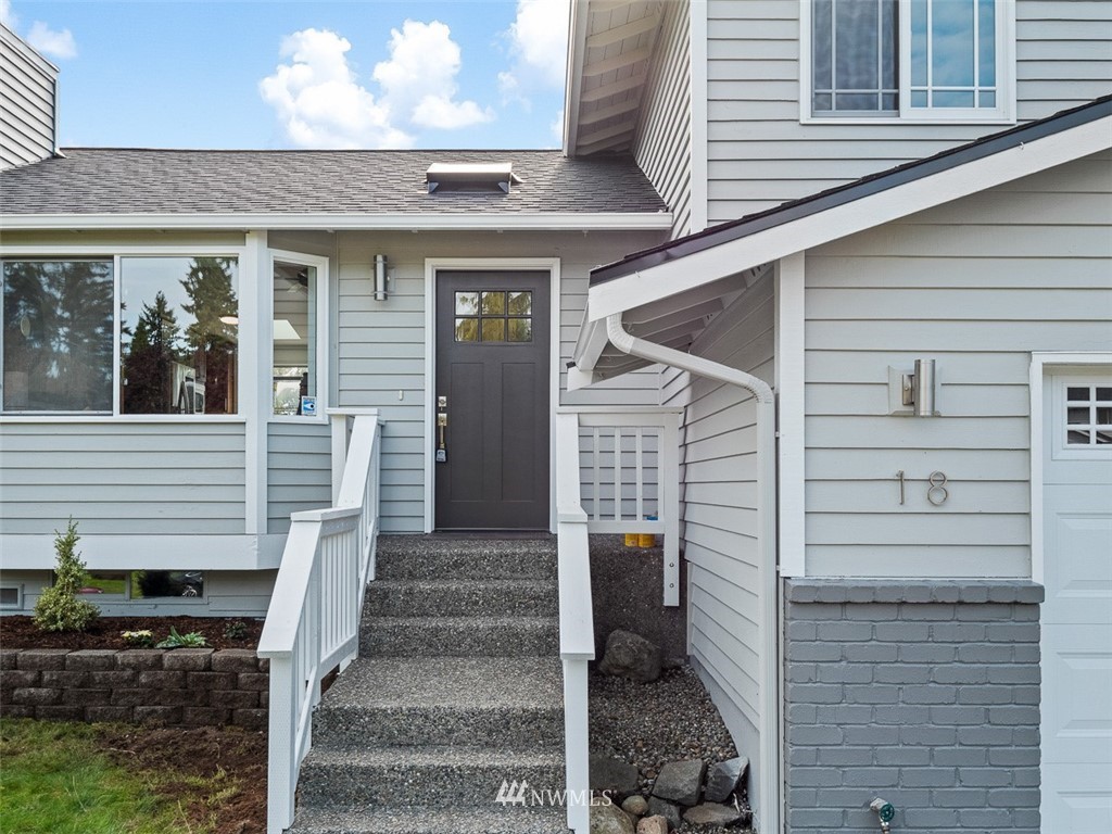 18 199th Place Southeast Bothell, WA 98012 - Photo 2 of 23 a front view of a house with stairs