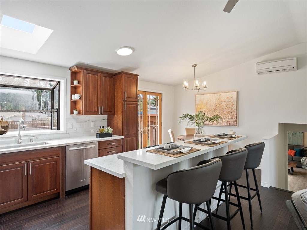 18 199th Place Southeast Bothell, WA 98012 - Photo 11 of 23 a kitchen that has a table and chairs in it