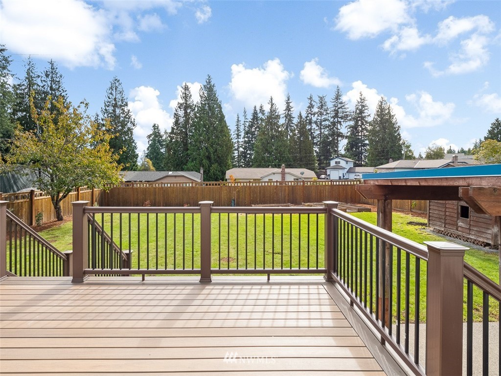 18 199th Place Southeast Bothell, WA 98012 - Photo 12 of 23 a view of a wooden deck and a yard