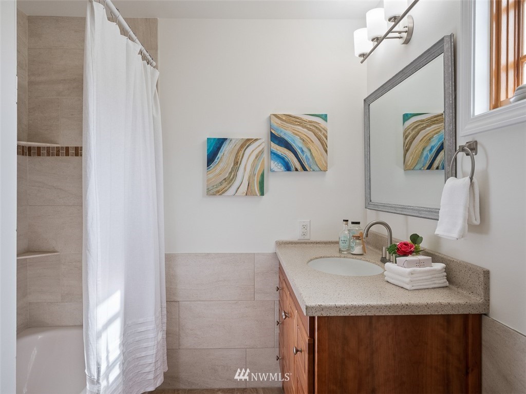 18 199th Place Southeast Bothell, WA 98012 - Photo 22 of 23 a bathroom with a sink and a mirror