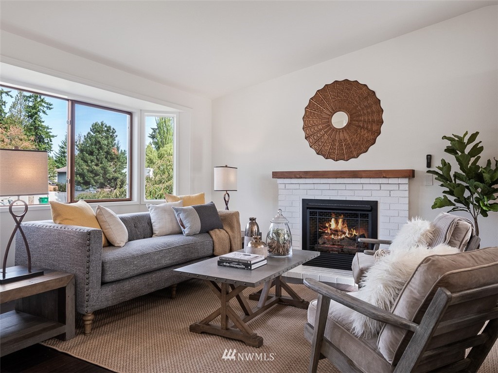 18 199th Place Southeast Bothell, WA 98012 - Photo 6 of 23 a living room with furniture and a fireplace