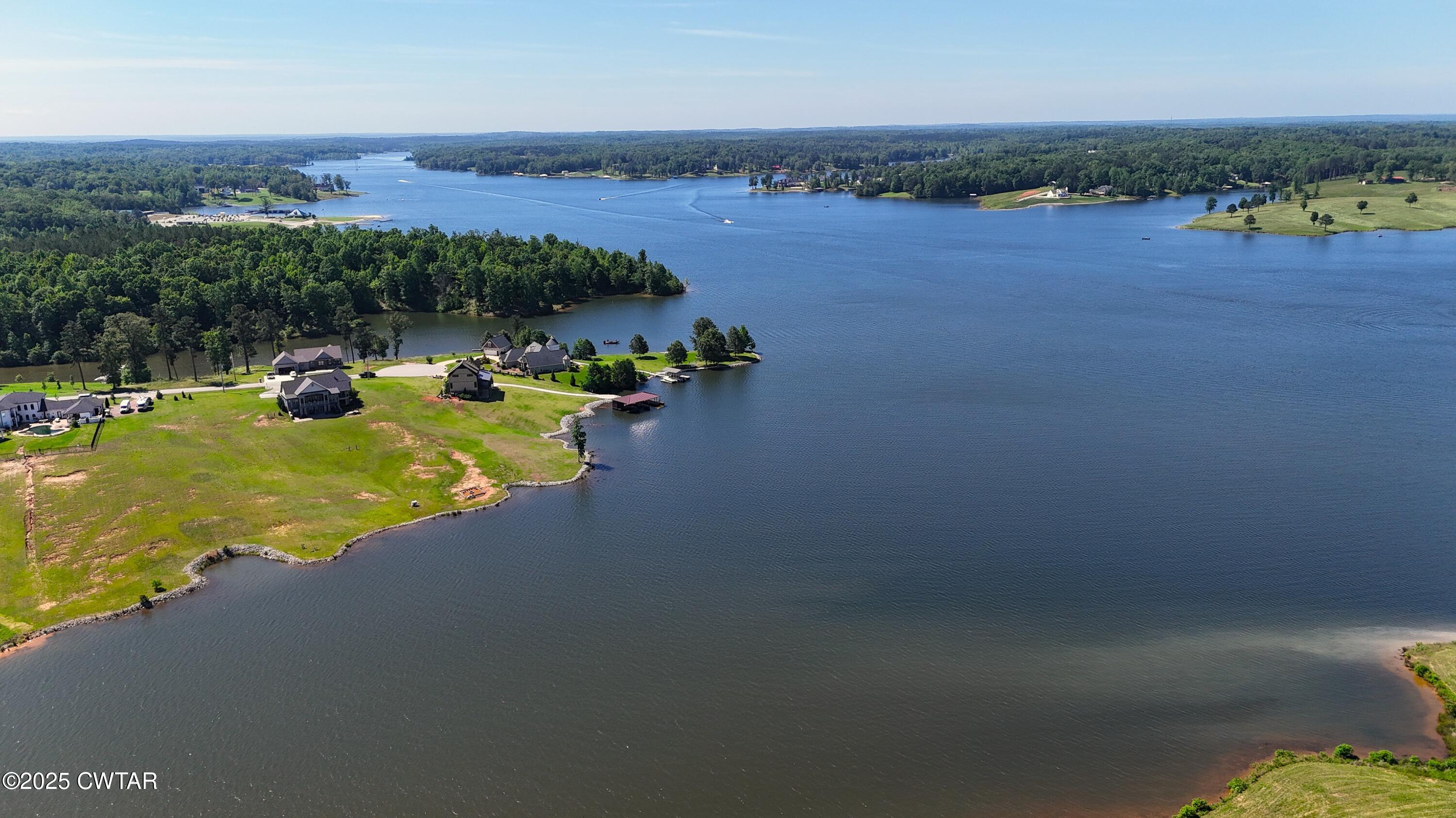 398 Baker Road Huntingdon, TN 38344 - Photo 14 of 23 a view of a lake with houses in the back