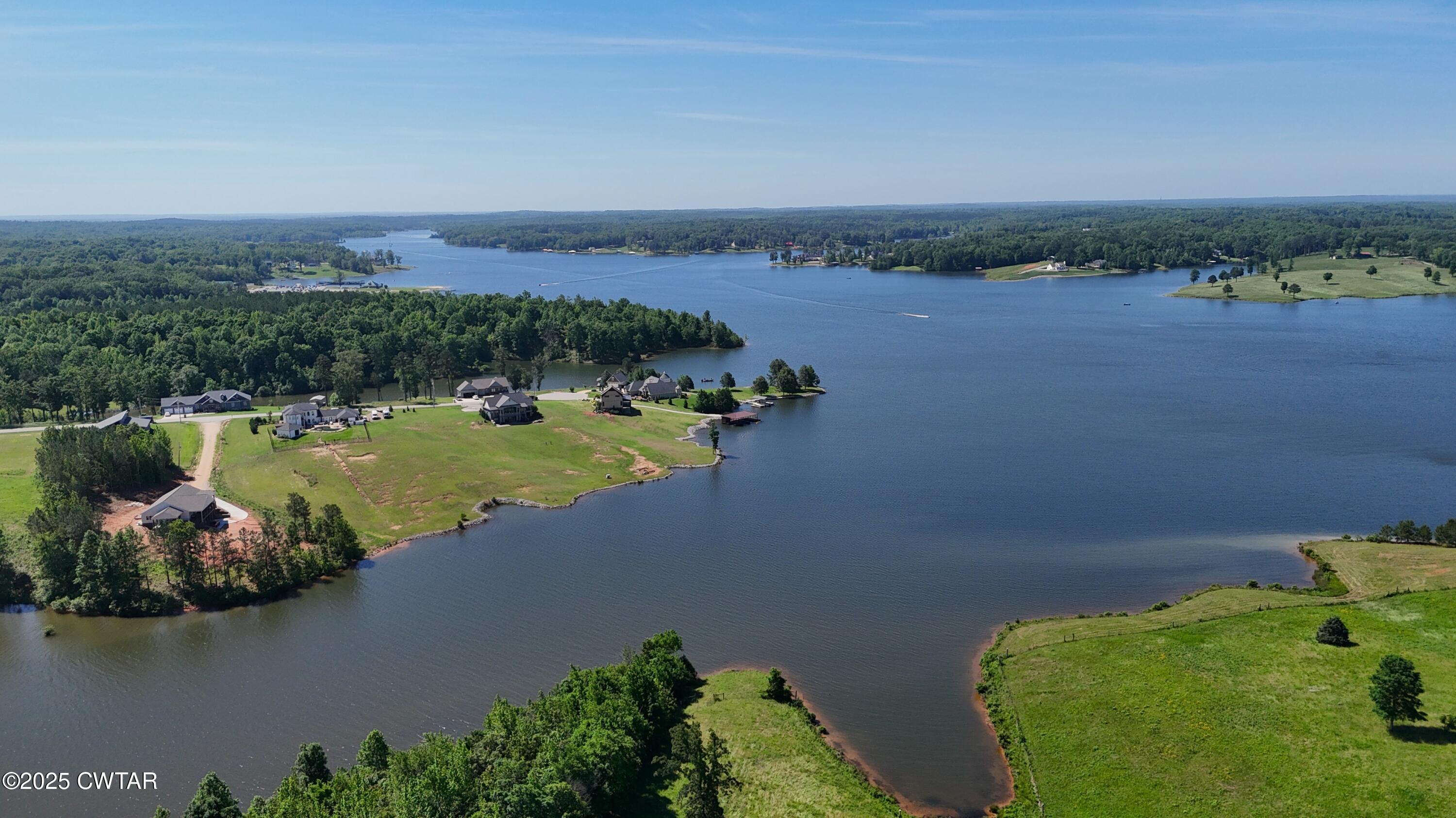 398 Baker Road Huntingdon, TN 38344 - Photo 16 of 23 an aerial view of a house with a garden and lake view