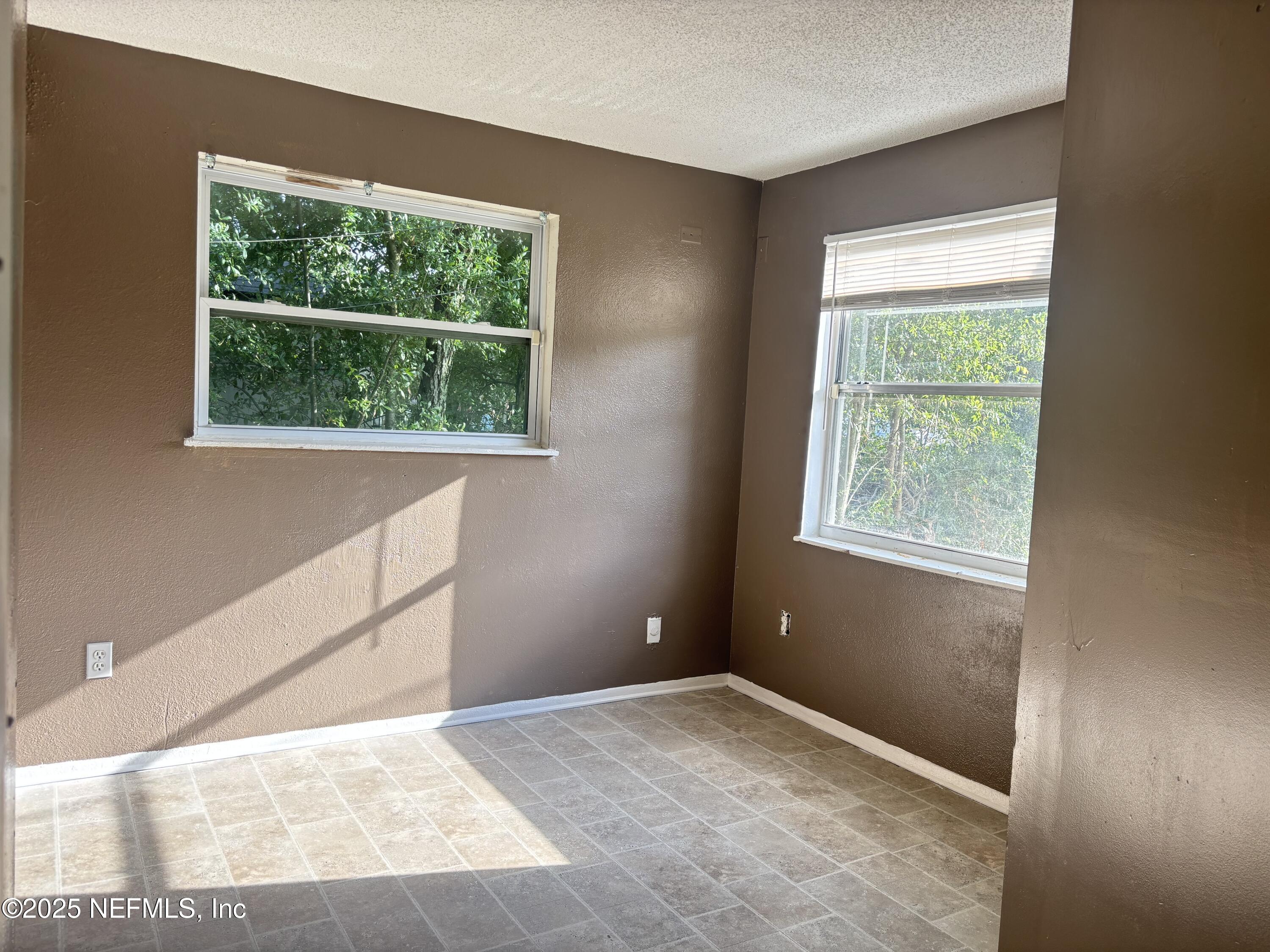 1115 Rushing Street Jacksonville, FL 32209 - Photo 11 of 24 a view of an empty room with a window