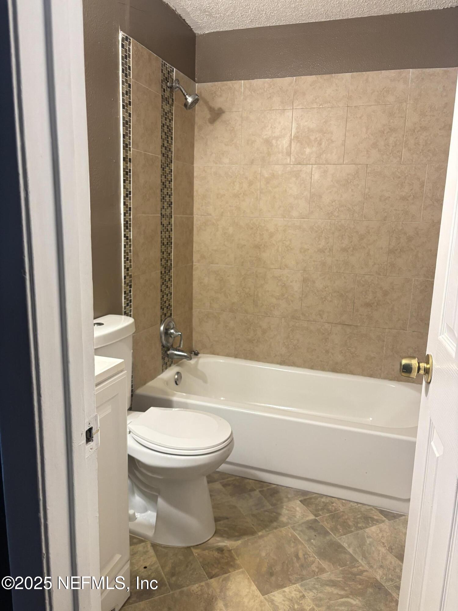 1115 Rushing Street Jacksonville, FL 32209 - Photo 12 of 24 a bathroom with a toilet and a shower