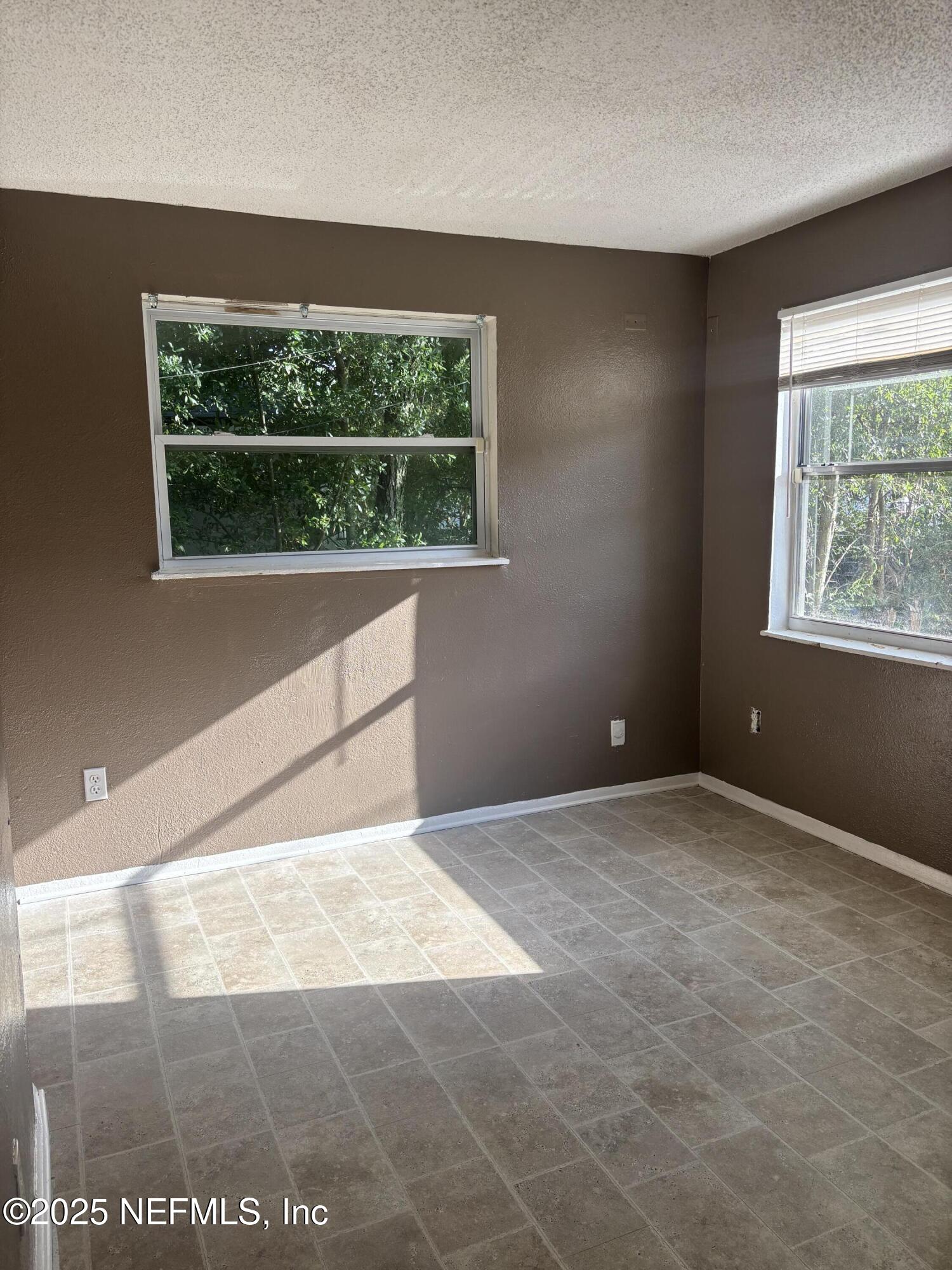 1115 Rushing Street Jacksonville, FL 32209 - Photo 14 of 24 a view of an empty room with a window