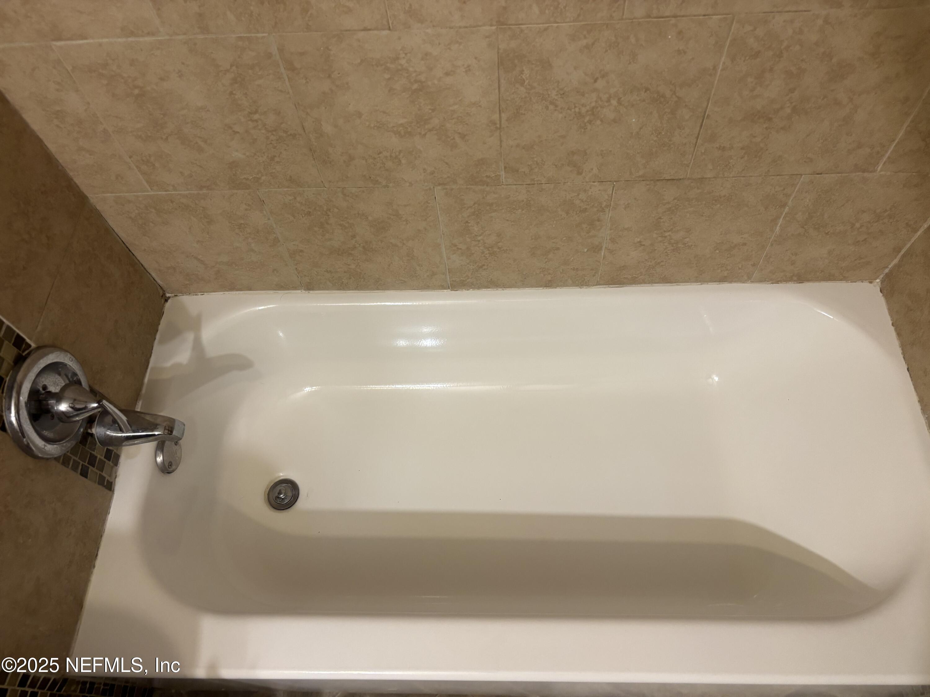 1115 Rushing Street Jacksonville, FL 32209 - Photo 15 of 24 a bathroom with a bathtub