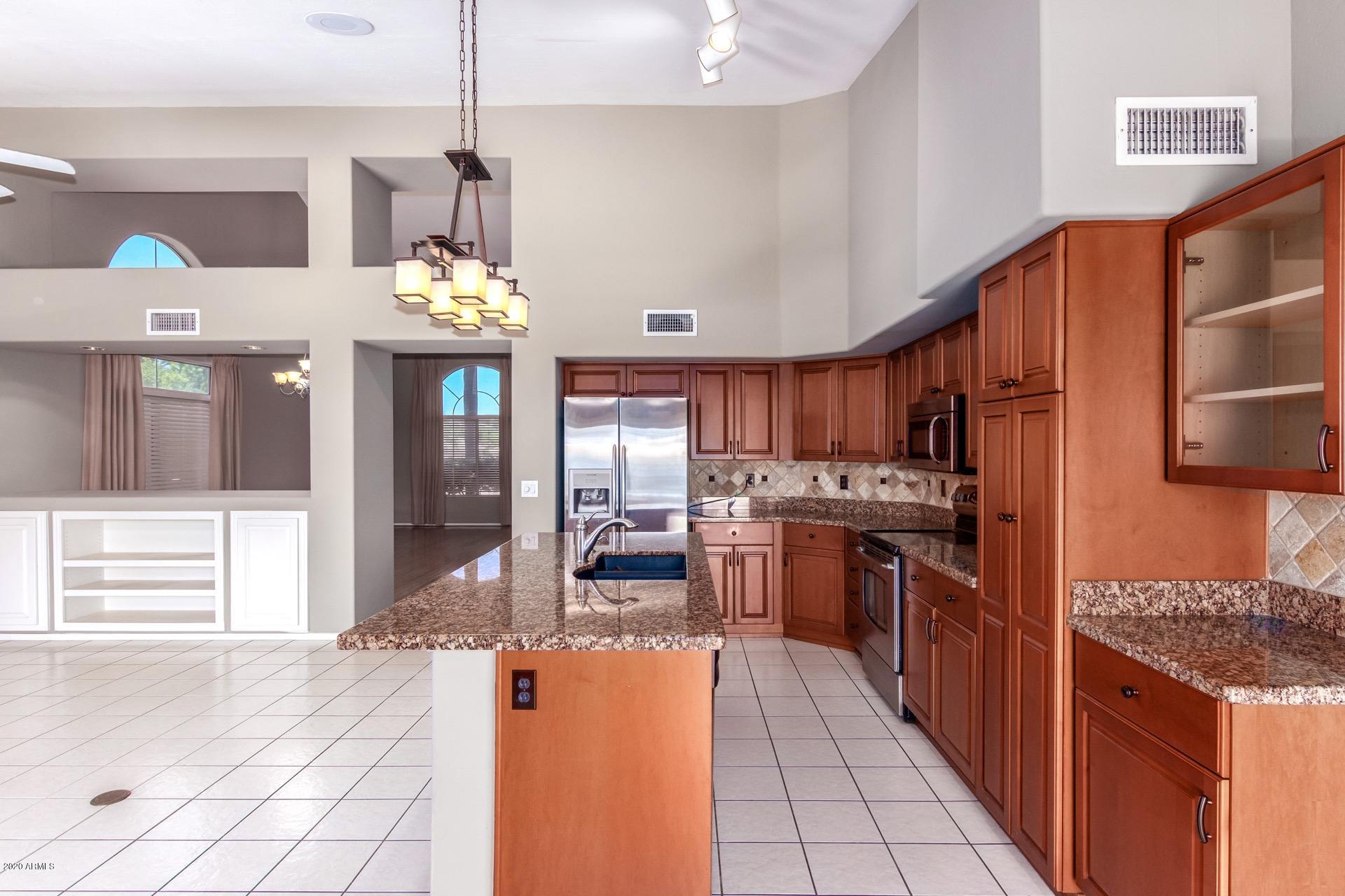 1256 East Redfield Road Phoenix, AZ 85022 - Photo 6 of 27 Kitchen view from door to patio