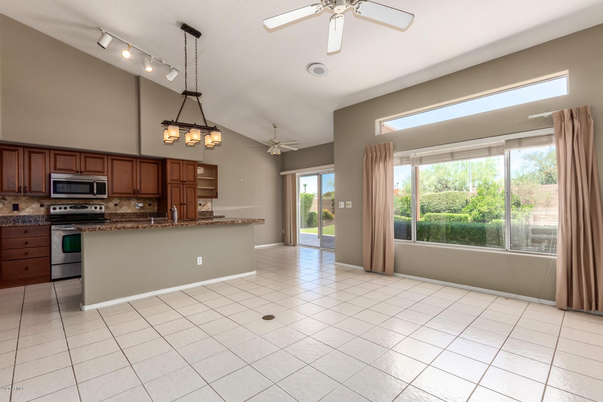 1256 East Redfield Road Phoenix, AZ 85022 - Photo 10 of 27 family room, kitchen & door to patio
