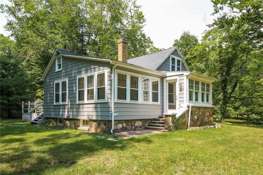 1718 Little Meadow Road Guilford, CT 06437 - Photo 1 of 1 a front view of house with yard