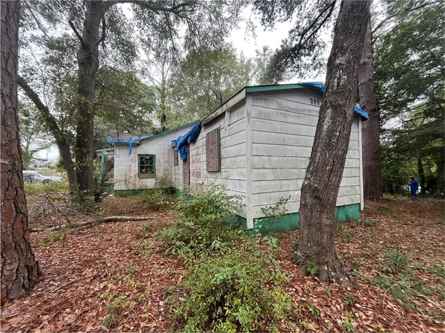 a house view with a backyard space