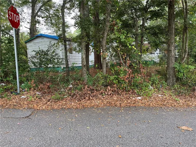 a backyard of a house with lots of green space