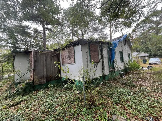 a house with a tree in front of it