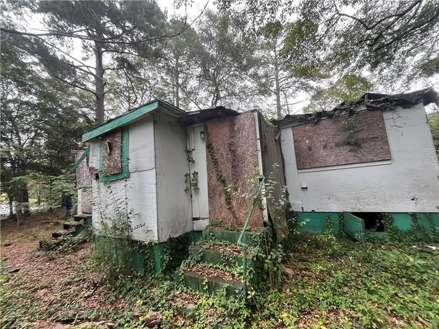 a backyard of a house with lots of green space
