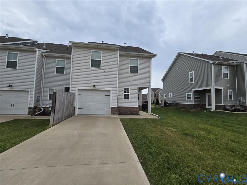 7825 Old Guild Road Richmond, VA 23237 - Photo 27 of 27 Contemporary townhome exterior featuring light-ton