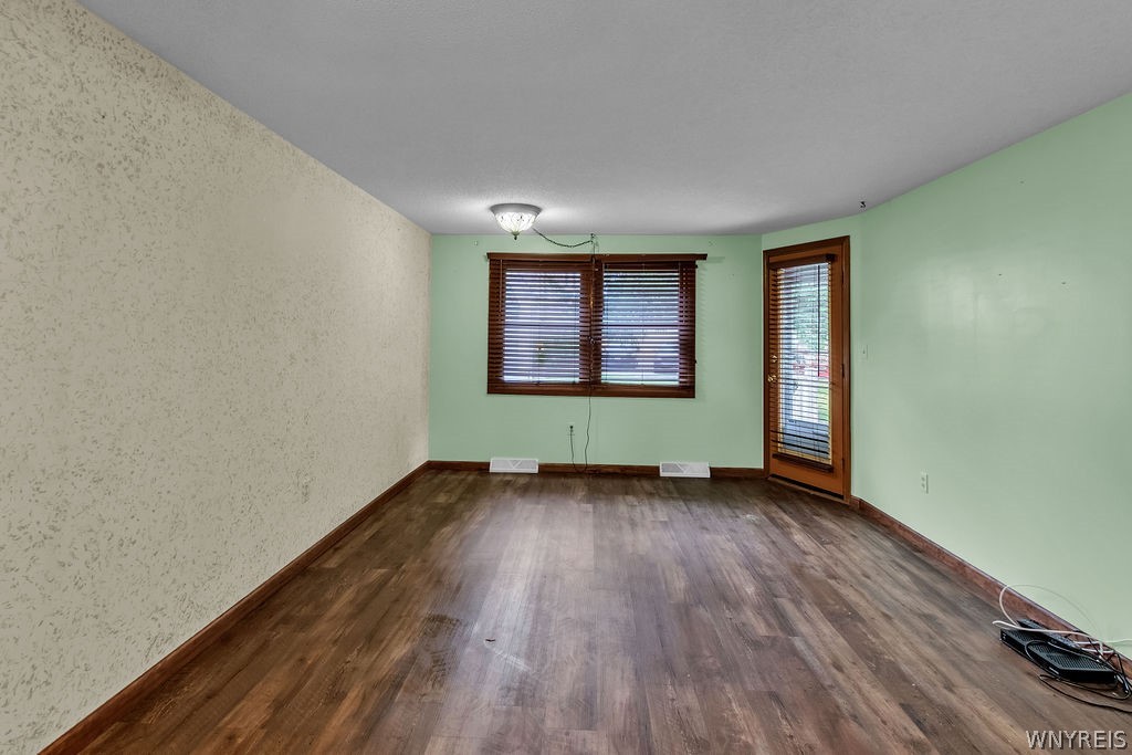4755 Chestnut Ridge Road, Unit 9 Amherst, NY 14228 - Photo 24 of 46 Living room area with door to rear deck